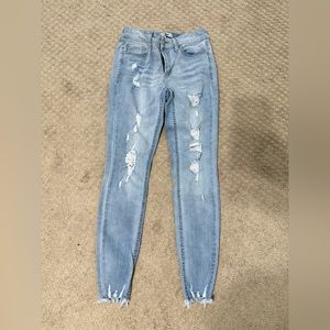 Light wash skinny jeans with rips